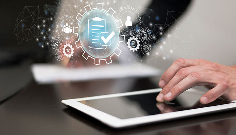 Person using tablet with digital compliance checklist and gears, representing NDIS compliance services and organizational support.